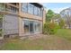 Backyard patio with sliding glass door to the home at 10423 Carrollbrook Cir # 102, Tampa, FL 33618