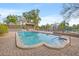 Inviting community pool featuring a large pool area and comfortable lounge chairs for residents to relax and enjoy at 10423 Carrollbrook Cir # 102, Tampa, FL 33618