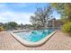 Beautiful pool and deck overlooking the serene lake, furnished with lounge chairs for relaxation and enjoyment at 10423 Carrollbrook Cir # 102, Tampa, FL 33618