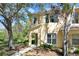 Charming two-story home featuring a covered entry and manicured landscaping, set against a sunny backdrop at 10906 Johanna Ave, Riverview, FL 33578