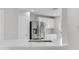 Close up of a kitchen showcasing modern stainless steel appliances and bright, white cabinetry at 10906 Johanna Ave, Riverview, FL 33578