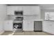 Well-equipped kitchen with stainless steel appliances, white cabinets, and modern fixtures at 10906 Johanna Ave, Riverview, FL 33578