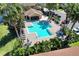 A refreshing community pool surrounded by lush landscaping and comfortable lounging areas at 10906 Johanna Ave, Riverview, FL 33578