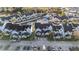 Aerial view of the community featuring townhouses, a central waterway with fountain, and parking areas at 12253 Armenia Gables Cir # 12253, Tampa, FL 33612