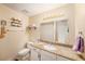 Bathroom features a white vanity with granite countertop and standard commode at 12253 Armenia Gables Cir # 12253, Tampa, FL 33612