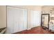 Bedroom features lots of closet space, with a long mirror and hard wood flooring at 12253 Armenia Gables Cir # 12253, Tampa, FL 33612
