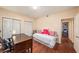 Bedroom features hard wood floors, a desk, and standard size closet at 12253 Armenia Gables Cir # 12253, Tampa, FL 33612