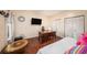 Bedroom features hard wood floors, a desk, and standard size closet at 12253 Armenia Gables Cir # 12253, Tampa, FL 33612