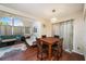Cozy dining area featuring hardwood floors, chandelier lighting, and ample seating for four at 12253 Armenia Gables Cir # 12253, Tampa, FL 33612