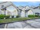 Charming condo exterior featuring a unique arched window and well-maintained landscaping at 12253 Armenia Gables Cir # 12253, Tampa, FL 33612