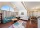 Bright and airy living room with large arched window, hardwood floors, and comfortable seating at 12253 Armenia Gables Cir # 12253, Tampa, FL 33612