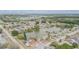 The aerial view showcases a lakeside community with a variety of houses and green spaces at 1232 Persimmon Dr, Holiday, FL 34691