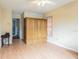 Bedroom with laminate floors, ceiling fan and closet providing ample storage and natural light at 1232 Persimmon Dr, Holiday, FL 34691