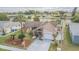 Charming single-story home featuring manicured front yard, stone accents, and attached garage at 1232 Persimmon Dr, Holiday, FL 34691