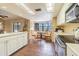 Spacious kitchen boasts a breakfast nook, great views, and lots of natural light at 1232 Persimmon Dr, Holiday, FL 34691