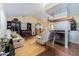 Cozy living room with hardwood floors, a fireplace, and ample seating at 1232 Persimmon Dr, Holiday, FL 34691