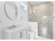 Bright bathroom featuring a walk-in shower and a modern vanity at 1239 36Th N Ave, St Petersburg, FL 33704