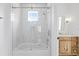 Bright bathroom featuring a shower-tub, vanity and white tile at 1239 36Th N Ave, St Petersburg, FL 33704