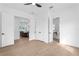 Bedroom featuring hardwood floors with an ensuite bath and views of the dining room at 1239 36Th N Ave, St Petersburg, FL 33704