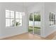 Bright breakfast nook featuring a globe pendant light and view of the backyard at 1239 36Th N Ave, St Petersburg, FL 33704