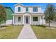 Charming two-story home with a well-manicured lawn and inviting brick pathway at 1239 36Th N Ave, St Petersburg, FL 33704