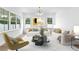 Bright living room featuring large windows, neutral decor, and modern furnishings at 1239 36Th N Ave, St Petersburg, FL 33704