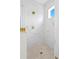 Walk-in shower featuring marble tile walls, a hexagon tile floor and brass fixtures at 1239 36Th N Ave, St Petersburg, FL 33704