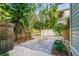 Inviting backyard with a stone patio and wooden fence, perfect for outdoor gatherings and relaxation at 129 18Th N Ave, St Petersburg, FL 33704