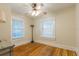 Bright bedroom with hardwood floors, two windows, and neutral paint at 129 18Th N Ave, St Petersburg, FL 33704