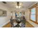Dining room with a round glass table, hardwood floors, and natural light from the window at 129 18Th N Ave, St Petersburg, FL 33704