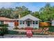 Charming bungalow with brick pathway, covered porch, and mature landscaping in the front yard at 129 18Th N Ave, St Petersburg, FL 33704