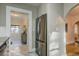 View of the kitchen, stainless steel refrigerator, and doorway leading to an adjacent room at 129 18Th N Ave, St Petersburg, FL 33704