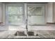 Close up of a stainless steel double sink with a granite countertop and white subway tile backsplash at 129 18Th N Ave, St Petersburg, FL 33704