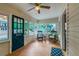 Bright sunroom featuring a ceiling fan, many windows, and comfortable seating at 129 18Th N Ave, St Petersburg, FL 33704
