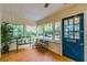 Sunroom with tiled floor, bench seating, and lots of windows at 129 18Th N Ave, St Petersburg, FL 33704