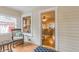 Cozy sunroom with patterned tile floor, wicker furniture, and a view of the living room at 129 18Th N Ave, St Petersburg, FL 33704