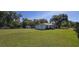 Spacious backyard with lush greenery and a storage shed, perfect for outdoor activities and storage at 1413 Lithia Pinecrest Rd, Brandon, FL 33511