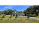 Charming single-story home with manicured lawn, white picket fence, and inviting curb appeal at 1413 Lithia Pinecrest Rd, Brandon, FL 33511