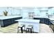 Contemporary kitchen with white cabinets, stainless steel appliances, an island, and modern stools at 1413 Lithia Pinecrest Rd, Brandon, FL 33511