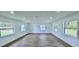Spacious living room with lots of natural light and modern wood-look flooring, ready for personalized decorating at 1413 Lithia Pinecrest Rd, Brandon, FL 33511