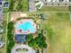 Aerial shot of a community pool showcasing its large size, various amenities, and green surroundings at 14454 Barley Field Dr, Wimauma, FL 33598