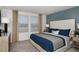 Comfortable bedroom featuring a plush bed, neutral walls, and abundant natural light at 15120 Cuzcorro Ct, Nokomis, FL 34275