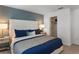 Comfortable bedroom featuring a plush bed, neutral walls, and abundant natural light at 15120 Cuzcorro Ct, Nokomis, FL 34275