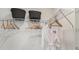 Well-organized walk-in closet with shelving, hanging space, and included robe and storage baskets at 15120 Cuzcorro Ct, Nokomis, FL 34275