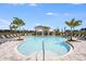 Large, inviting community pool with lounge chairs and umbrellas, perfect for outdoor relaxation at 15120 Cuzcorro Ct, Nokomis, FL 34275
