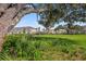 Beautiful green space with lush landscaping, walking paths, and a dog park, perfect for outdoor enjoyment at 15120 Cuzcorro Ct, Nokomis, FL 34275