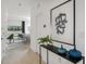 Open-concept hallway leading to living area, complemented by modern decor and ample natural light at 15120 Cuzcorro Ct, Nokomis, FL 34275