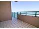 Cozy balcony with tiled floor and ocean view, providing a peaceful outdoor retreat at 1520 Gulf Blvd # Ph2, Clearwater Beach, FL 33767