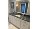 Bathroom featuring a stylish vanity with a granite countertop and modern fixtures at 1520 Gulf Blvd # Ph2, Clearwater Beach, FL 33767