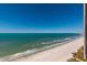 Expansive beach view featuring clear blue sky and ocean, with soft sand and gentle waves at 1520 Gulf Blvd # Ph2, Clearwater Beach, FL 33767